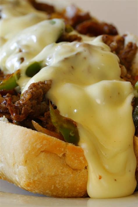 Philly Cheesesteak Sandwich Recipe with roast beef, onion, green bell pepper, garlic, and ...