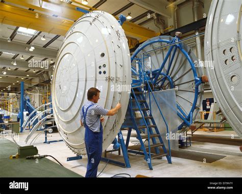 Aircraft mechanic assembling 1/6-segment pressure bulkhead during Stock Photo, Royalty Free ...