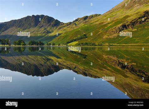 Reflections at sunrise in Lake Buttermere Stock Photo - Alamy