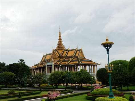 an ornate building in the middle of a garden