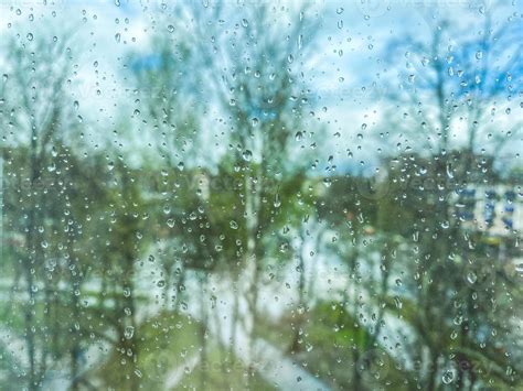 reflection in glass, window of a multi-storey building. raindrops on ...