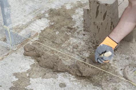 Bricklayer Working with Mud Bricks for Building a Wall. Stock Image - Image of ancient, level ...