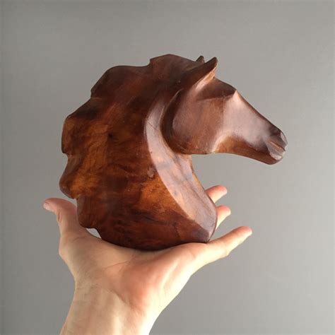 carved wooden horse head sculpture
