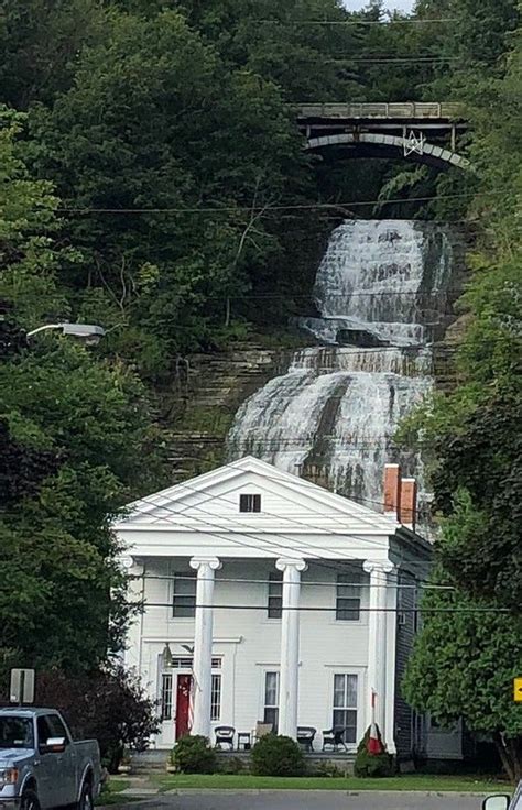 Montour Falls, New York. The Greek Revival Style home in the foreground ...