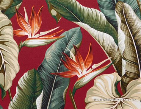 a red and green tropical print wallpaper with flowers, leaves and plants on it