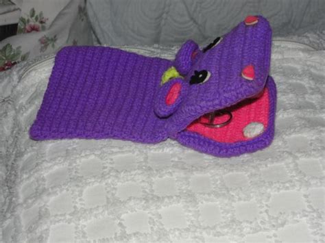 Crocheted hand puppet | Crochet ponytail hat pattern, Hand puppets, Crochet hippo