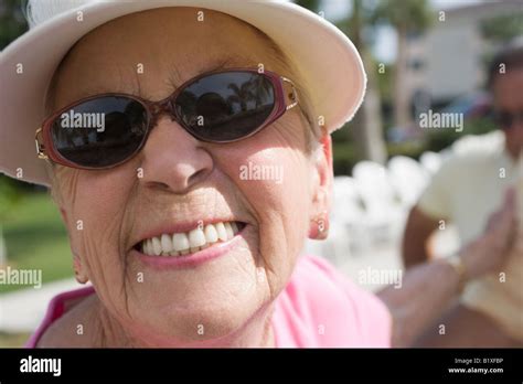 Portrait of a senior woman smiling Stock Photo - Alamy