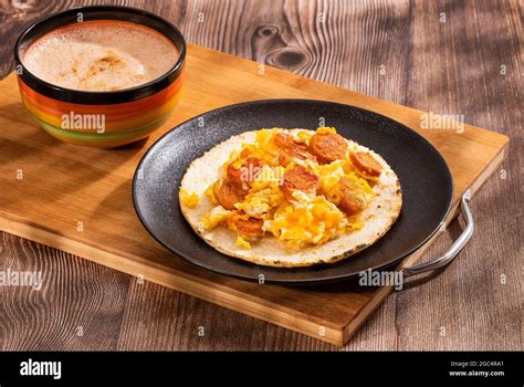 Colombian breakfast with arepa, Sausage and egg - Traditional food Stock Photo - Alamy