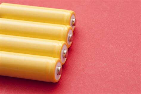 Free Stock image of Set of four yellow unlabeled batteries | ScienceStockPhotos.com