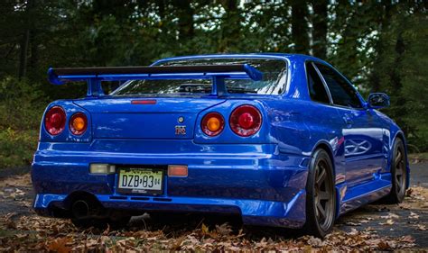 Download Close-up Nissan Skyline GT-R R34 Vehicle Nissan Skyline GT-R 4k Ultra HD Wallpaper