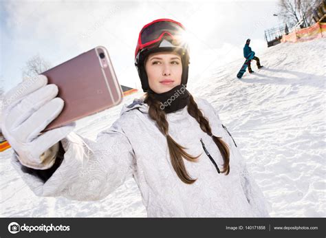 Snowboarder taking selfie — Stock Photo © SergIllin #140171858