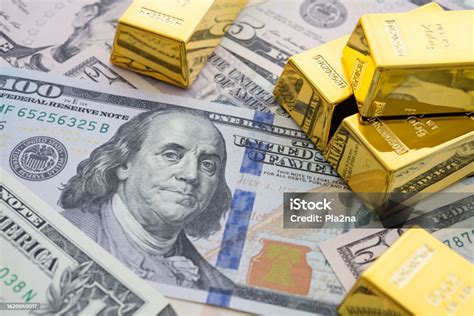Gold Bars On Us Dollar Bill Banknotes Background Stock Photo - Download ...