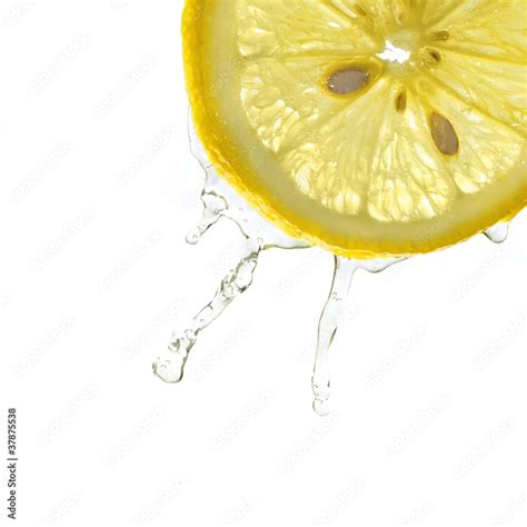 Lemon slice in water splash, isolated Stock Photo | Adobe Stock