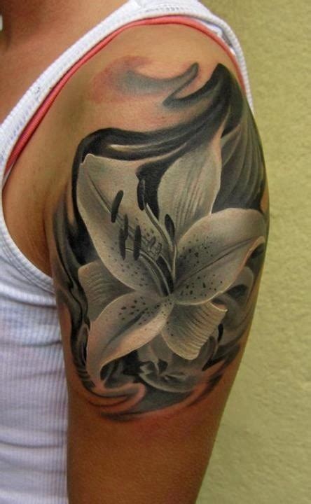 Black lily tattoo on shoulder - Tattooimages.biz