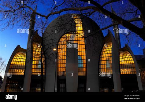 the illuminated cologne central mosque at dusk Stock Photo - Alamy