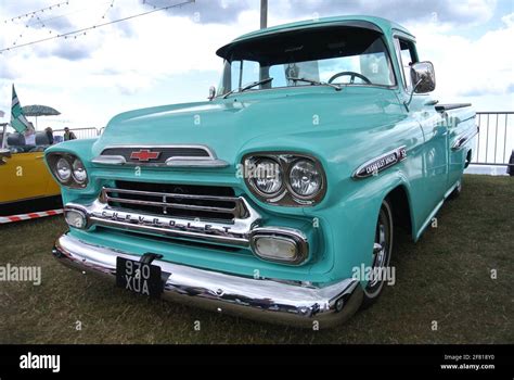 A 1959 Chevrolet GMC Apache pickup truck parked up on display at the English Riviera classic car ...