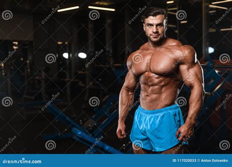 Handsome Model Muscle Man Abs Workout in Gym Stock Image - Image of ...