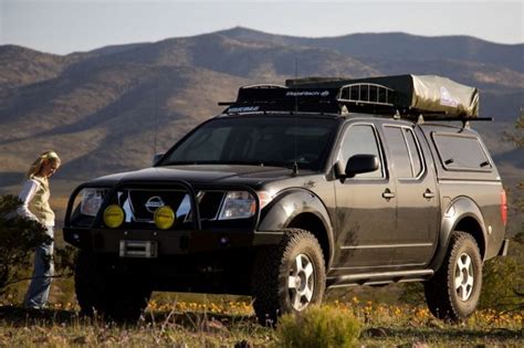 Nissan Frontier with ARE Series V Camper Shell with the swing up side window option. | Nissan ...