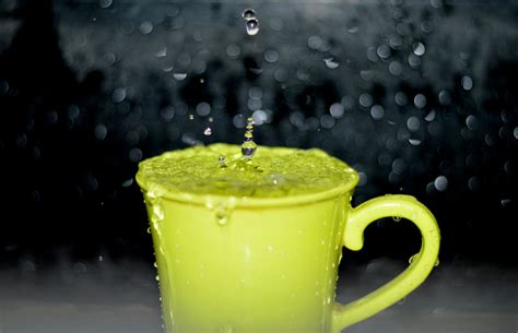 Yellow Ceramic Mug With Water Droplets in Time Lapse Photography · Free Stock Photo
