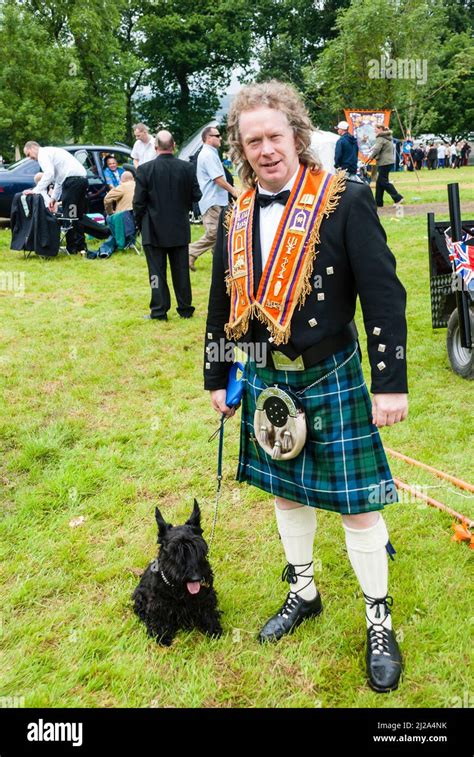 Belfast, Northern Ireland. 12th July 2007. Scottish man with a scottish terrier, wearing an ...