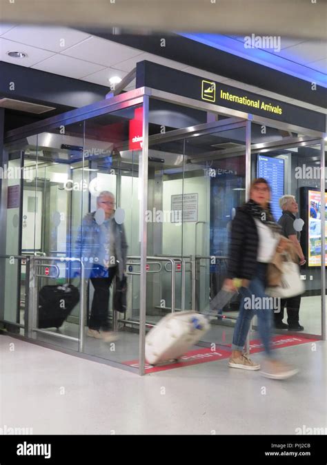 Passengers arrive at international arrival lounge Leeds Bradford Airport, England Stock Photo ...