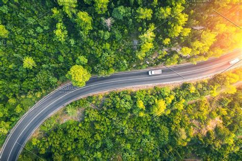 Aerial view of road in beautiful #Sponsored , #Ad, #forest#green#summer#sunset Summer Sunset ...