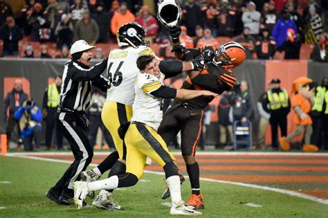 NFL star Myles Garrett smacks Mason Rudolph over the head with his helmet in 'worst ever' brawl ...