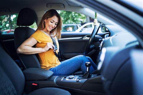 Safety First Beautiful Female Driver Putting Seat Belt On Before Driving A Car Stock Photo ...