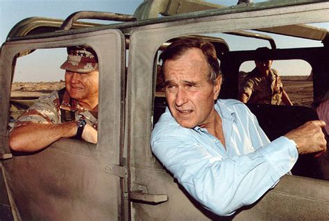 Norman Schwarzkopf, Jr. and President George H. W. Bush visiting troops during the Gulf War ...