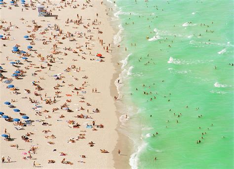 People On Beach An In Water, Aerial View by Matthias Clamer