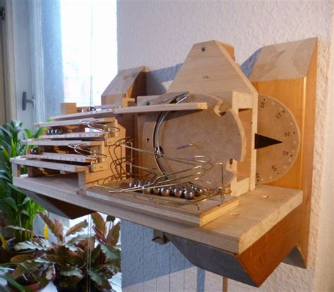 A Curiously Mesmerizing Mechanical Rolling Ball Clock