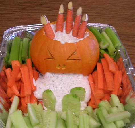 Made this for my daughter's class party. Puking pumpkin with hand coming out of the head ...