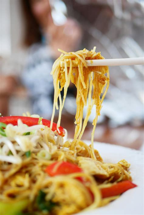 Person Picking Cooked Noodles with Chopsticks · Free Stock Photo