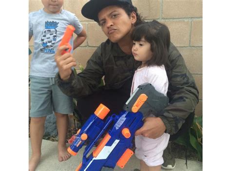 Bruno Mars declared a Nerf Gun war posing with his kids. Super cute. - 21... - Capital XTRA