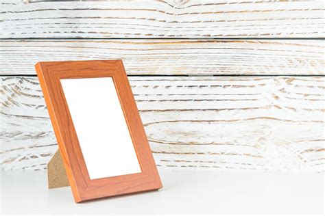 Frame on wood table 2193639 Stock Photo at Vecteezy