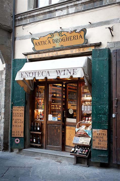 Wine And Drugstore Cortona Photograph by Robert Klemm