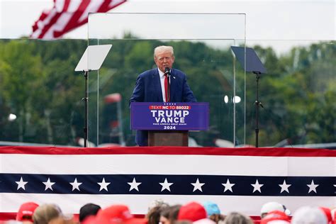 Trump speaks from behind bulletproof glass at first outdoor rally since ...