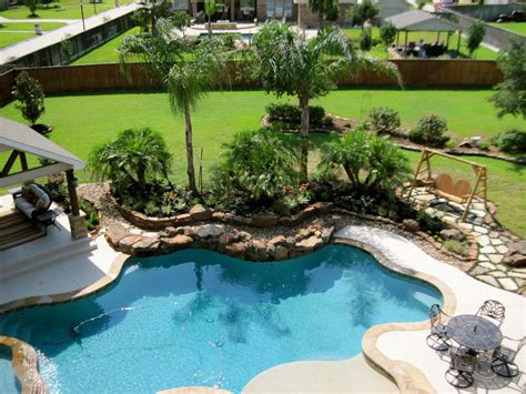 Backyard pool landscape - Tropical - Landscape - Houston - by Fox Landscaping