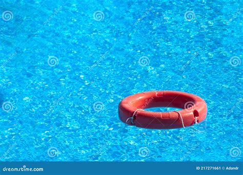 Red Lifebuoy Floating in Hotel Pool with Beautiful Blue Water Stock Image - Image of rubber ...