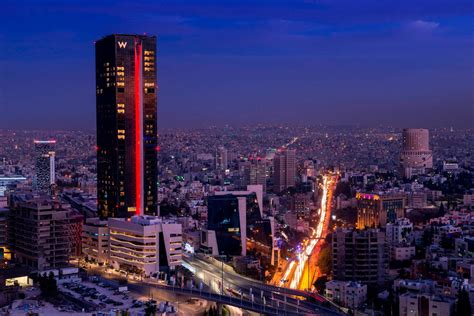 W Amman Hotel – Amman, Jordan – Hotel Tower Exterior Sunset – TRAVOH