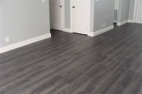 Tokyo Oak Grey Laminate (All rooms, minus the bathroom[s]). # ...