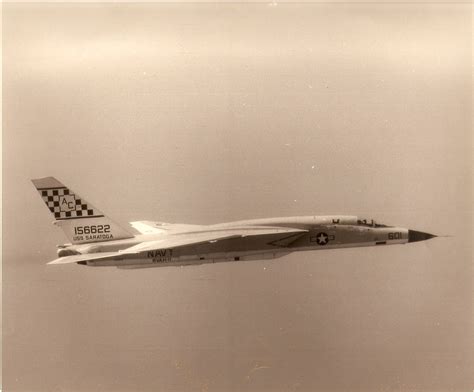 an air force jet flying through the sky with checkers on it's side