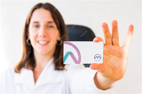 Premium PSD | Front view of defocused businesswoman holding business card