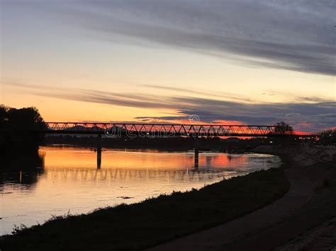 Silhouette of a Historic Bridge Over Water at Sunset in Slavonski Brod ...