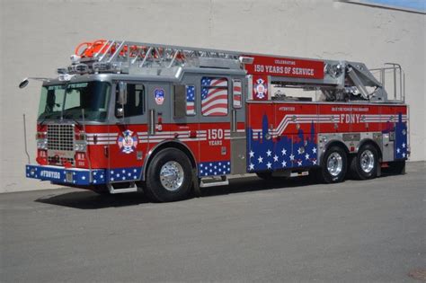 a red and blue fire truck parked in front of a building