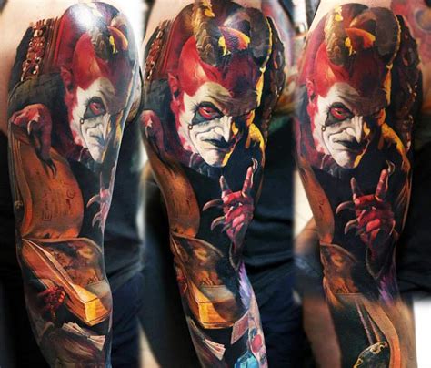 Colored horror style massive sleeve tattoo of devil with spell book - Tattooimages.biz