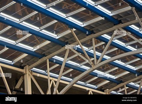 Solar panels on glass roof of modern building Stock Photo - Alamy