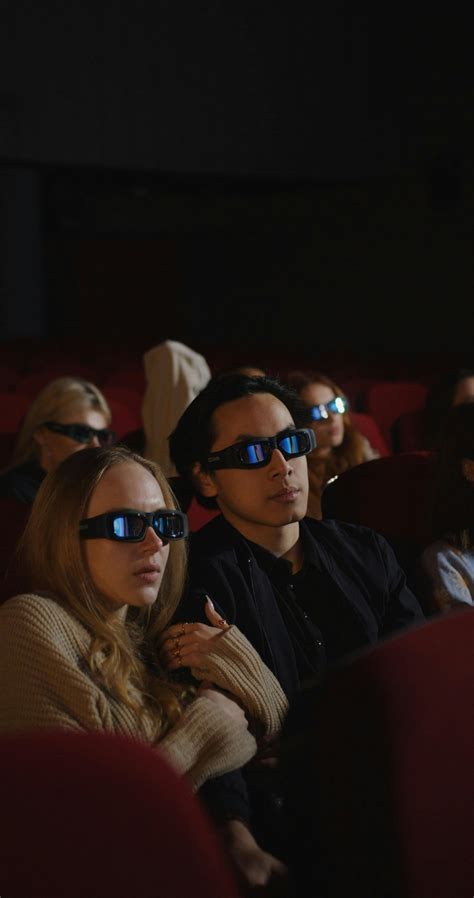 A Young Couple Watching a 3D Movie in a Cinema · Free Stock Video