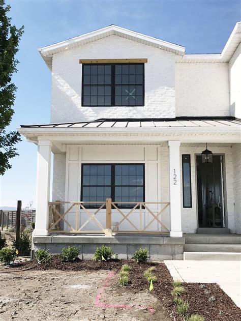 White brick, metal roof, black trim windows - studio McGee | Brick ...