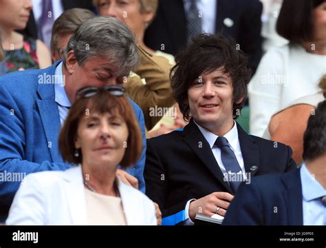 Stephen Fry and Elliott Spencer (right) in the Royal Box on day two of the Wimbledon ...